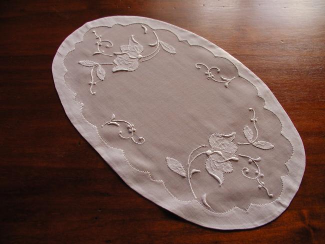 Lovely oval doily in organdi with appliqués