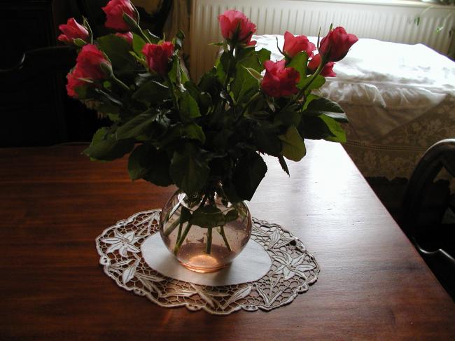 Lovely oval doily with embroidered lilies in Madeira